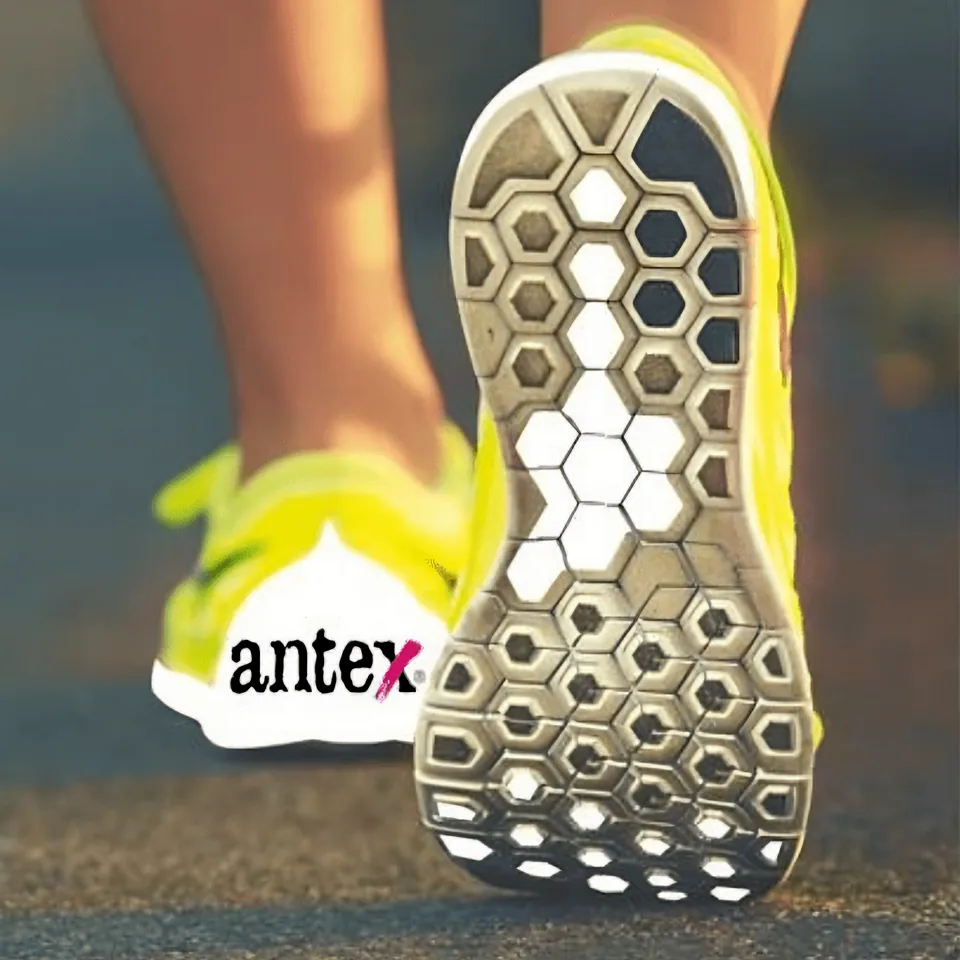 Running shoe with a honeycomb sole and the antex logo