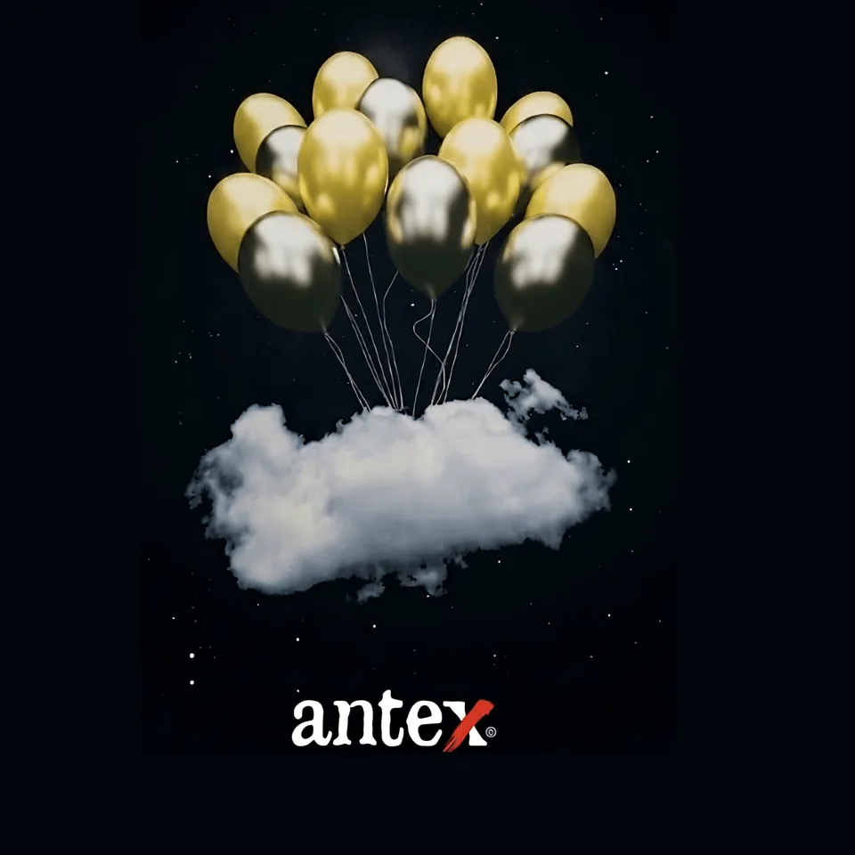 Gold and black balloons over a cloud with the antex logo